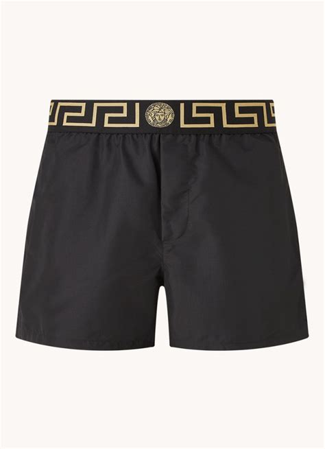 Versace Zwembroek met steekzakken en logoband .